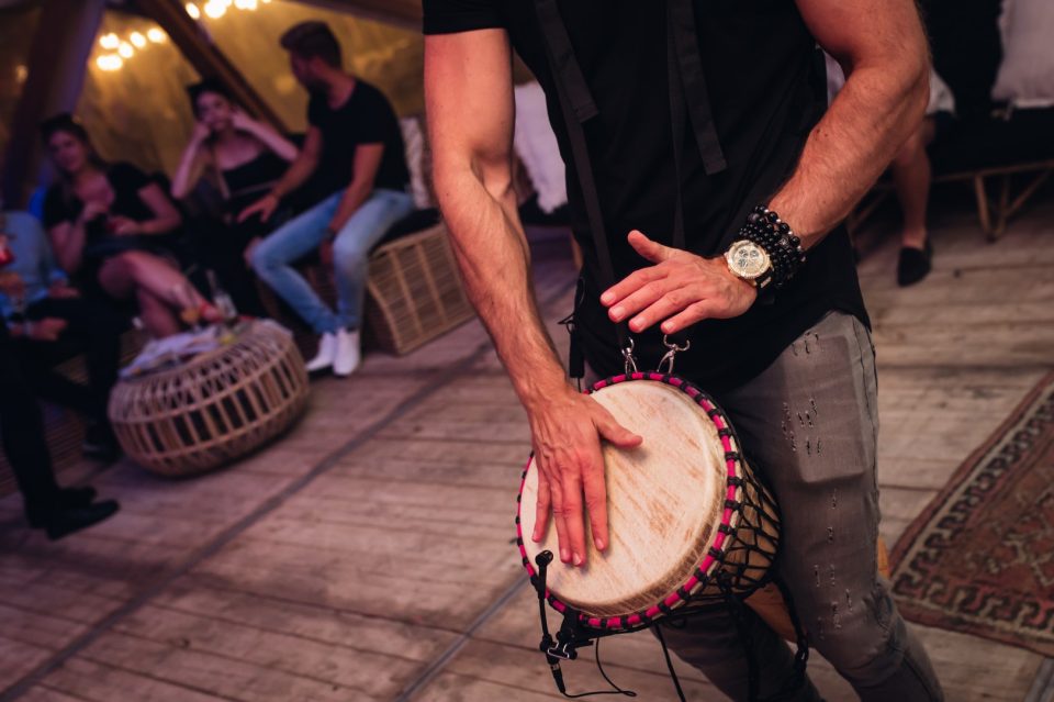 Detail of hands on a djembe during a relaxed lounge performance