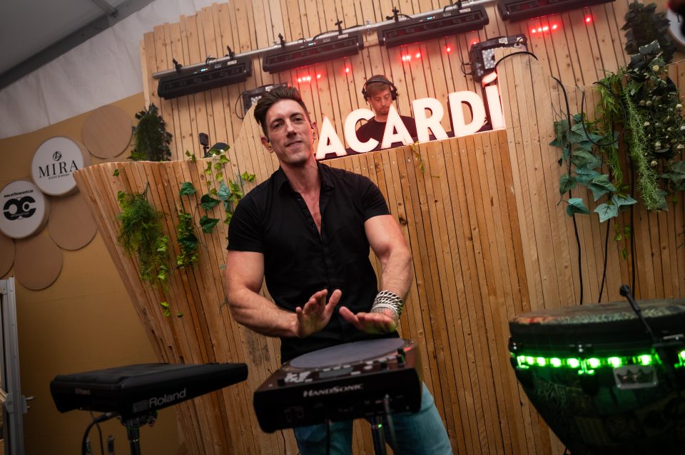 Sam Anderson playing live percussion at The Night